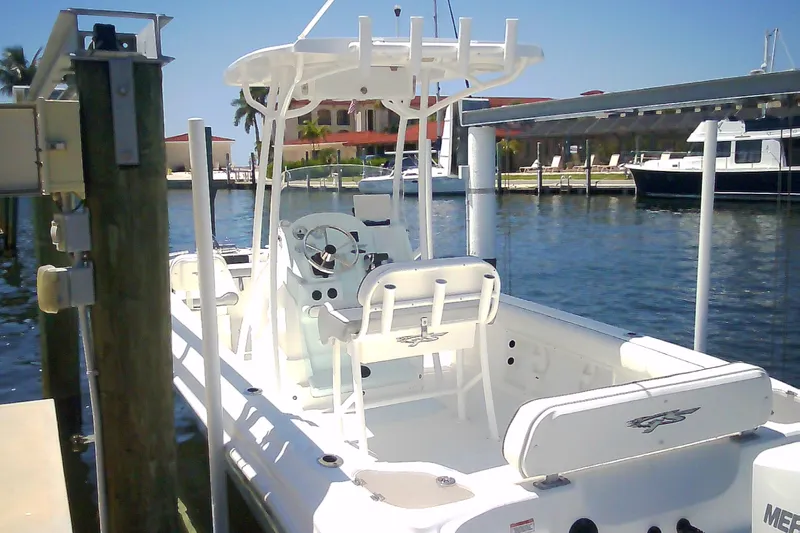 Slide: The Image of 2021 Glasstream 240 CCX boat docked at a marina under clear blue skies. - 9