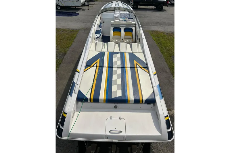 Slide: The Image of 2001 Donzi boat with colorful seating and sleek design, viewed from above. - 10