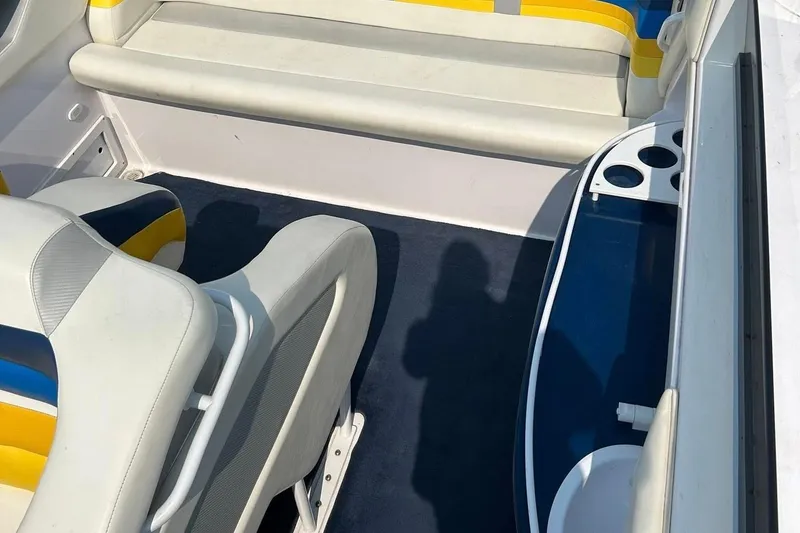 Slide: The Image of Interior of a 2001 Donzi boat with white and yellow seating. - 22
