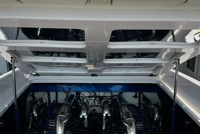 Slide: The Image of Engine compartment of a 2001 Donzi boat with open hatch, showcasing dual engines. - 23