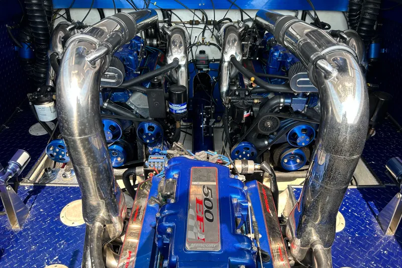 Slide: The Image of Engine compartment of a 2001 Donzi boat featuring dual Mercury 500 EFI engines. - 25