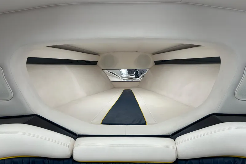 Slide: The Image of Interior of a 2001 Donzi boat cabin with sleek white and black design. - 30