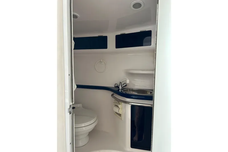 Slide: The Image of 2001 Donzi boat bathroom interior with toilet and sink. - 35