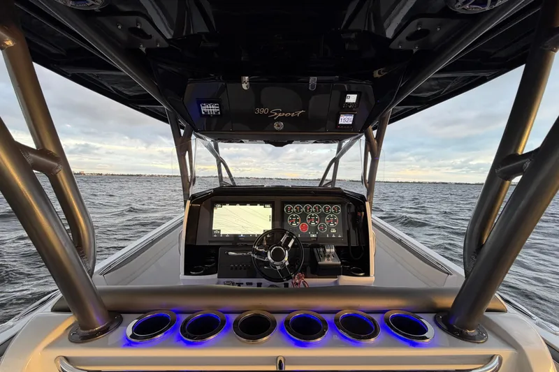 Slide: The Image of 2021 Nor-Tech 390 Sport Center Console boat dashboard with ocean view. - 13