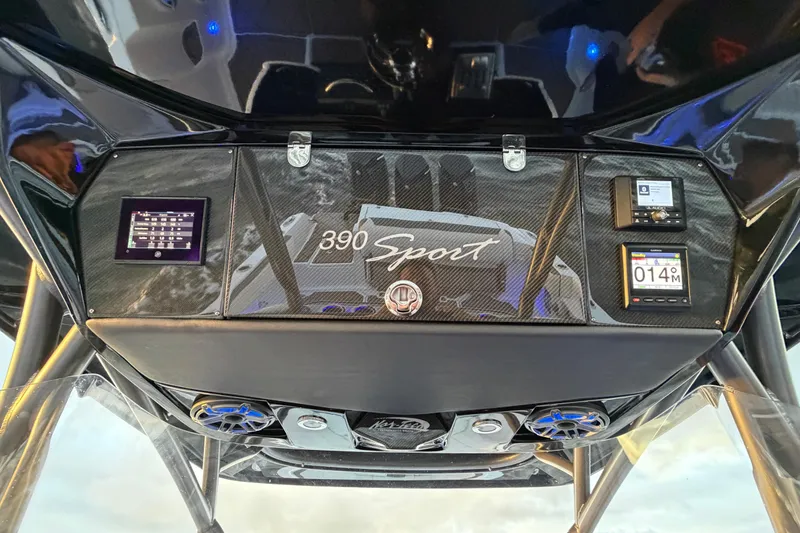 Slide: The Image of 2021 Nor-Tech 390 Sport Center Console dashboard with modern controls and sleek design. - 14