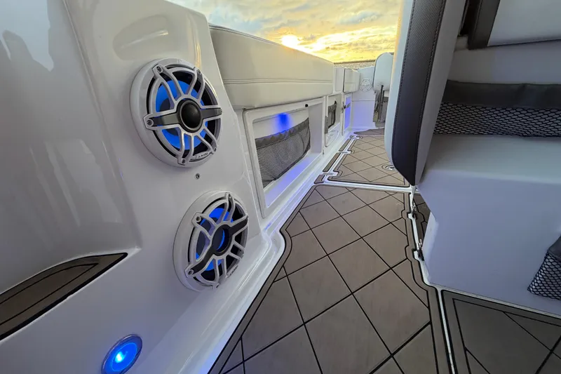 Slide: The Image of 2021 Nor-Tech 390 Sport Center Console interior with blue LED lights and stylish flooring. - 21