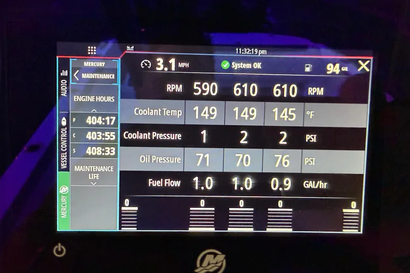 Slide: The Image of Dashboard display of a 2021 Nor-Tech 390 Sport Center Console showing engine metrics. - 28