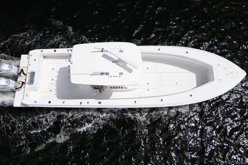 Slide: The Image of Overhead view of 2014 Contender 35 ST boat cruising on water. - 10