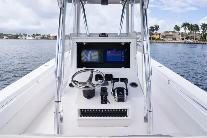 Slide: The Image of Center console of a 2014 Contender 35 ST boat with navigation equipment. - 24