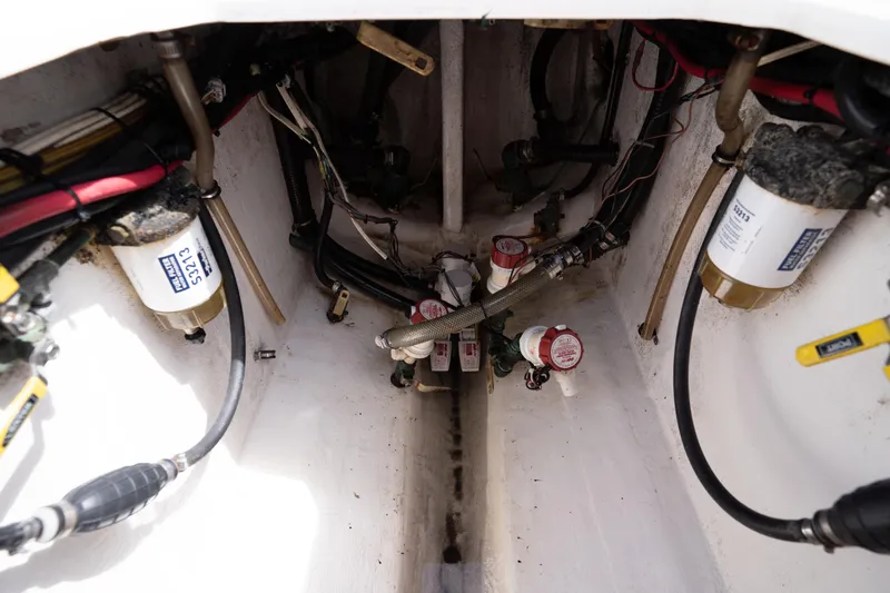 Slide: The Image of 2014 Contender 35 ST boat engine compartment with fuel filters and hoses. - 34
