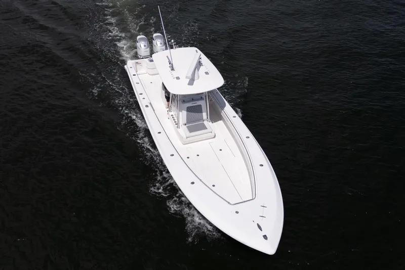 Slide: The Image of 2014 Contender 35 ST boat cruising on open water, aerial view. - 7