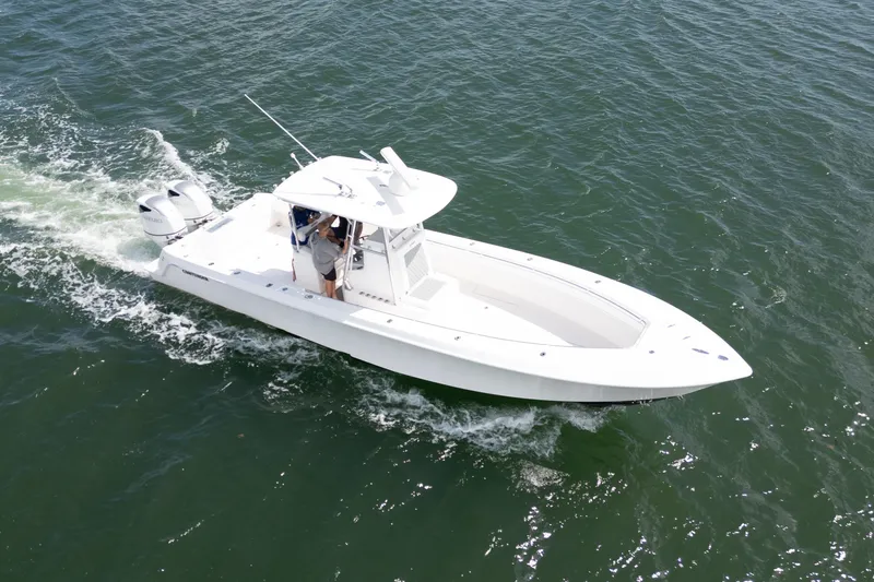 Slide: The Image of 2014 Contender 35 ST boat cruising on open water, aerial view. - 9