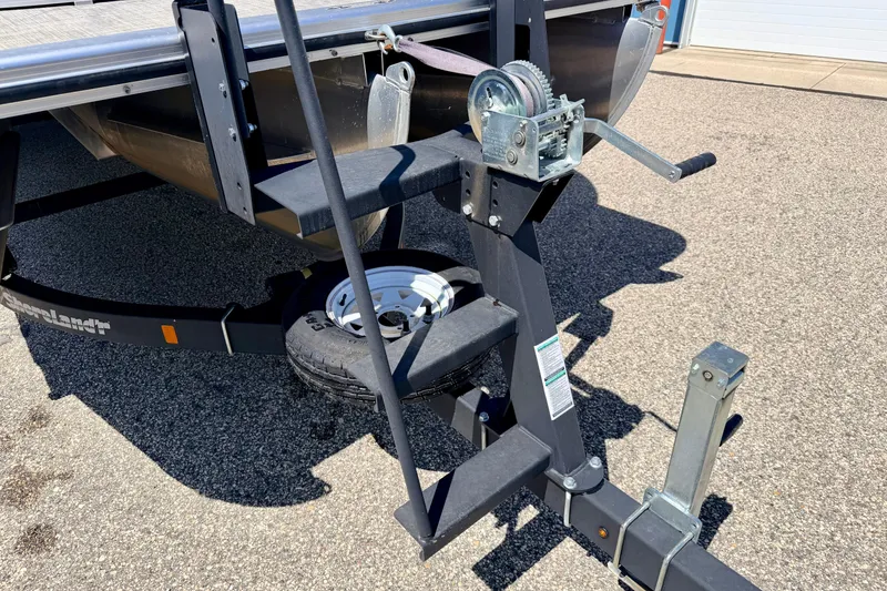 Slide: The Image of Trailer hitch and winch of 2019 Crestliner 240 Rally DX CW boat on pavement. - 15