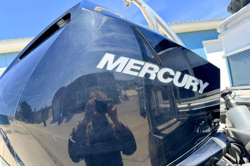 Slide: The Image of Mercury outboard motor on 2019 Crestliner 240 Rally DX CW boat, reflecting surroundings. - 18