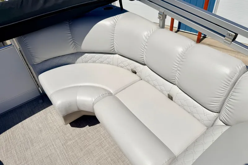 Slide: The Image of Luxurious seating on 2019 Crestliner 240 Rally DX CW boat, featuring plush white upholstery. - 23
