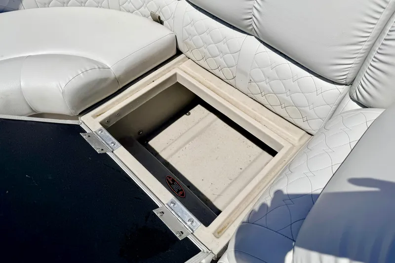 Slide: The Image of Storage compartment in 2019 Crestliner 240 Rally DX CW boat with white quilted seating. - 25