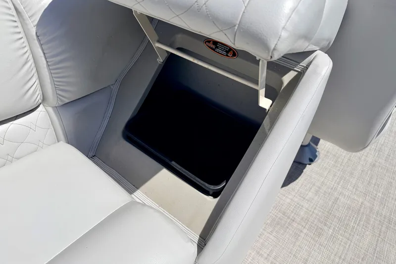 Slide: The Image of Crestliner 240 Rally DX CW 2019 boat seat with storage compartment open. - 26