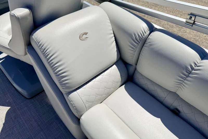 Slide: The Image of Luxurious seating on 2019 Crestliner 240 Rally DX CW boat, featuring elegant stitching and logo. - 27