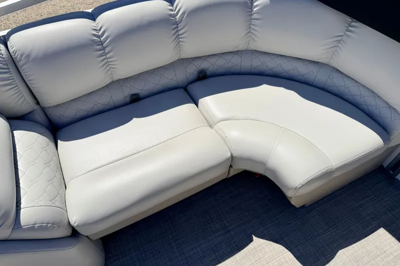 Slide: The Image of 2019 Crestliner 240 Rally DX CW boat seating with plush, white upholstery and quilted design. - 29