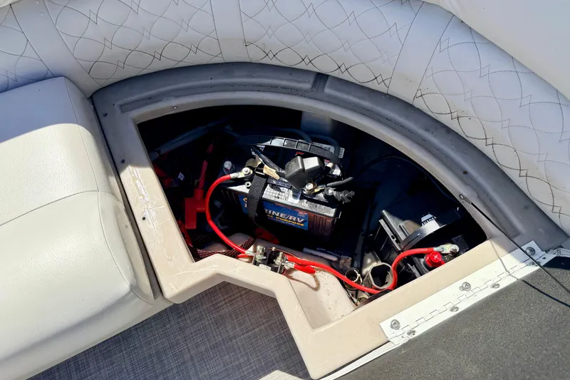 Slide: The Image of Battery compartment of 2019 Crestliner 240 Rally DX CW boat, featuring marine battery and wiring. - 30