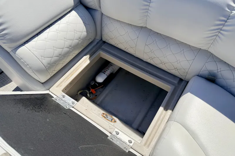 Slide: The Image of Storage compartment in 2019 Crestliner 240 Rally DX CW boat with fire extinguisher. - 31