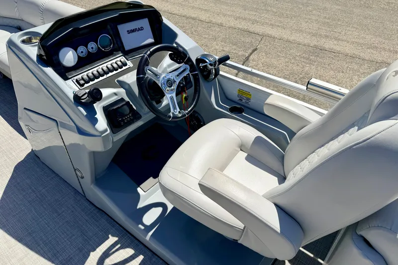 Slide: The Image of 2019 Crestliner 240 Rally DX CW boat helm with steering wheel and control panel. - 32