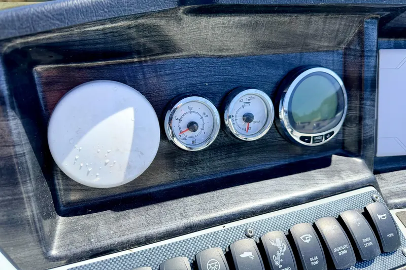 Slide: The Image of Dashboard of 2019 Crestliner 240 Rally DX CW with gauges and controls. - 34
