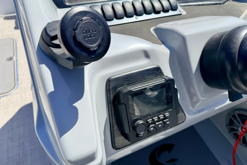 Slide: The Image of Control panel of 2019 Crestliner 240 Rally DX CW boat with audio system and controls. - 36