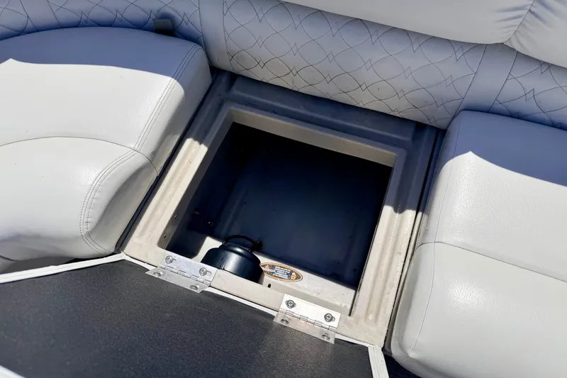 Slide: The Image of Storage compartment on 2019 Crestliner 240 Rally DX CW boat with cushioned seating. - 47
