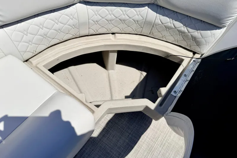 Slide: The Image of Storage compartment in 2019 Crestliner 240 Rally DX CW boat with quilted seating. - 51