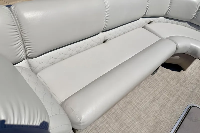 Slide: The Image of Luxurious seating on 2019 Crestliner 240 Rally DX CW boat, featuring plush white upholstery. - 52