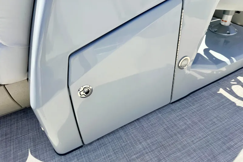 Slide: The Image of 2019 Crestliner 240 Rally DX CW boat interior detail with sleek storage compartment. - 55