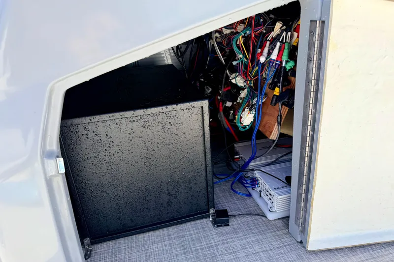 Slide: The Image of Interior view of a 2019 Crestliner 240 Rally DX CW boat showing wiring and equipment. - 56