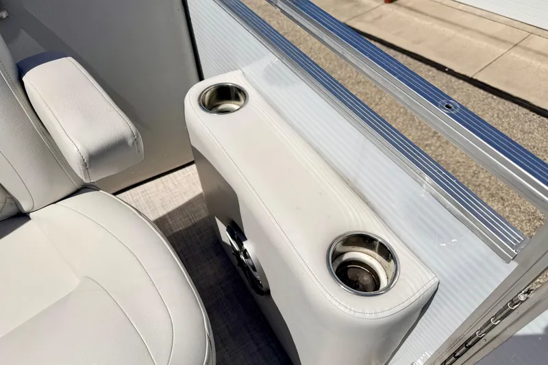 Slide: The Image of Crestliner 240 Rally DX CW 2019 boat interior with cup holders and seating detail. - 58