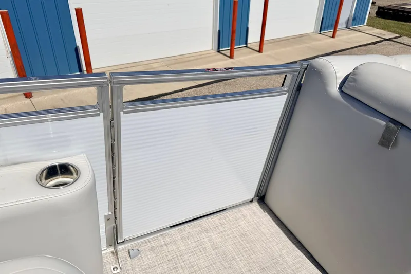 Slide: The Image of 2019 Crestliner 240 Rally DX CW boat interior with white seating and cup holder. - 59