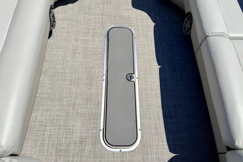 Slide: The Image of 2019 Crestliner 240 Rally DX CW boat interior with sleek flooring and cushioned seating. - 63