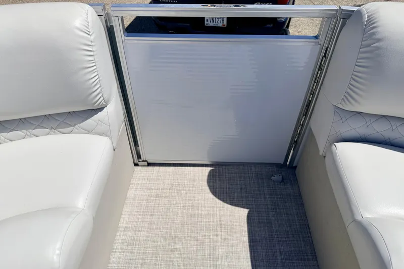 Slide: The Image of Interior of 2019 Crestliner 240 Rally DX CW boat with white seating and textured flooring. - 64