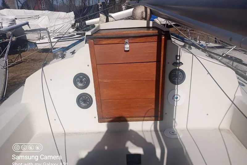 Slide: The Image of Cockpit of a 1980 C&C 30 Mk I sailboat with wooden hatch and gauges. - 3