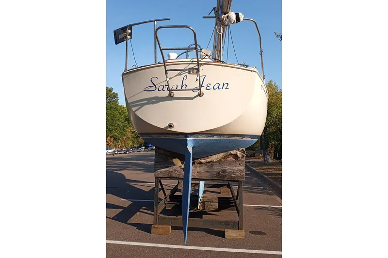 Slide: The Image of 1980 C&C 30 Mk I sailboat named "Sarah Jean" on a stand in a parking lot. - 5