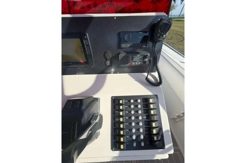Slide: The Image of Control panel of a 1992 Baja 280 Sportfish boat with navigation equipment. - 12