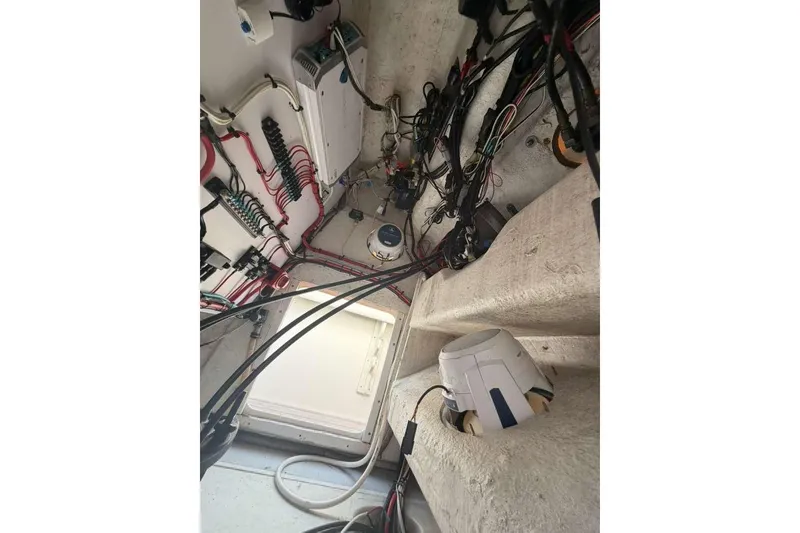 Slide: The Image of Interior wiring of a 1992 Baja 280 Sportfish boat, showcasing electrical components and cables. - 14