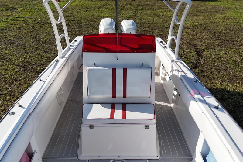 Slide: The Image of 1992 Baja 280 Sportfish boat interior with red and white seating, viewed from above. - 17
