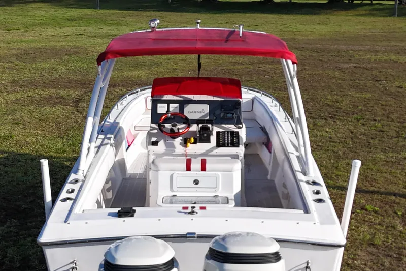 Slide: The Image of 1992 Baja 280 Sportfish boat with red canopy and modern navigation equipment. - 8