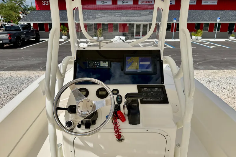 Slide: The Image of 2018 Skeeter SX2250 boat console with steering wheel and navigation display. - 12