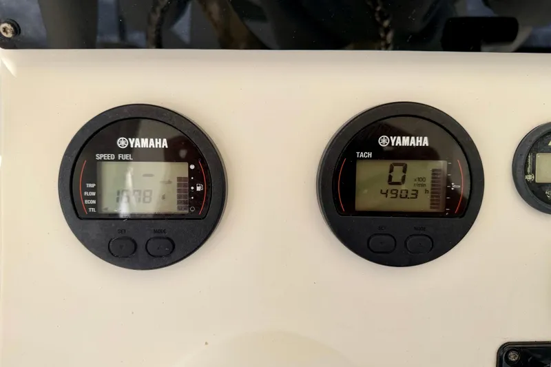Slide: The Image of Yamaha gauges on 2018 Skeeter SX2250 boat dashboard, displaying speed and tachometer readings. - 16