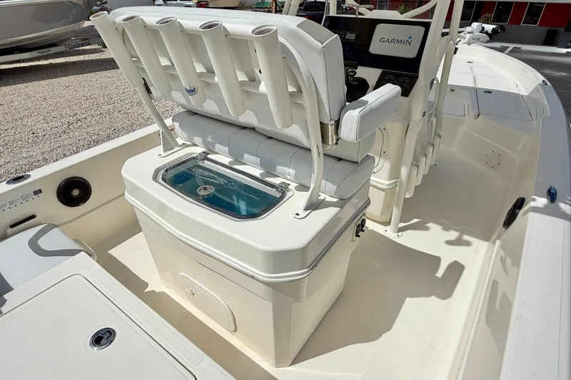 Slide: The Image of 2018 Skeeter SX2250 boat interior with Garmin system and rod holders. - 22