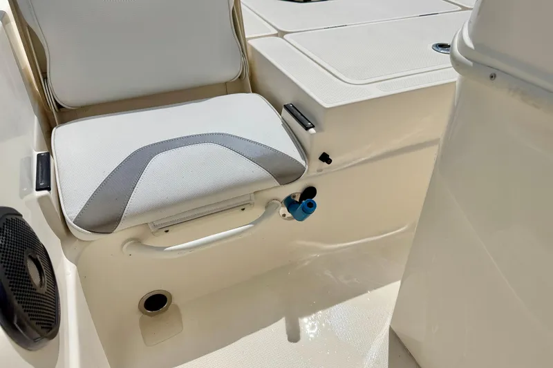 Slide: The Image of 2018 Skeeter SX2250 boat interior with cushioned seating and storage compartments. - 27