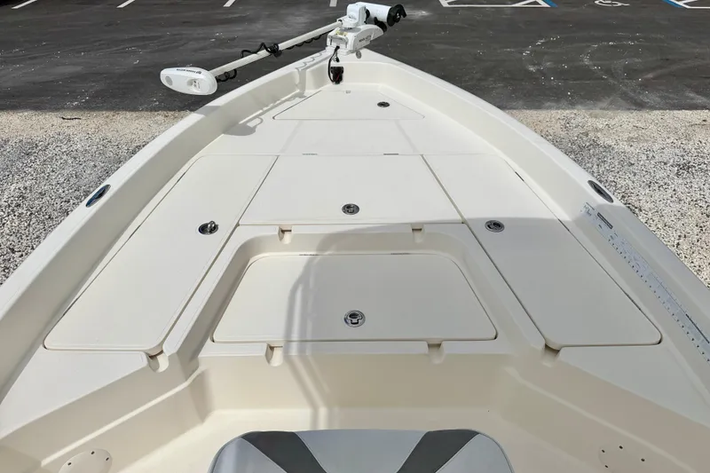 Slide: The Image of 2018 Skeeter SX2250 boat deck with storage compartments and trolling motor. - 28