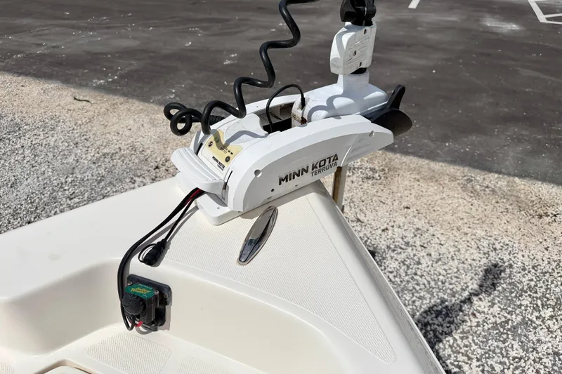 Slide: The Image of Minn Kota Terrova trolling motor on 2018 Skeeter SX2250 boat, parked on gravel. - 32