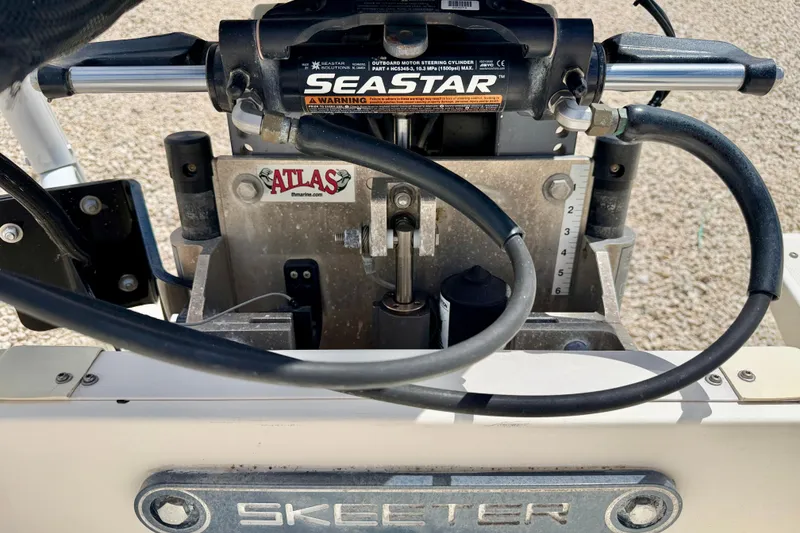 Slide: The Image of 2018 Skeeter SX2250 boat steering mechanism with SeaStar hydraulic system and Atlas components. - 33